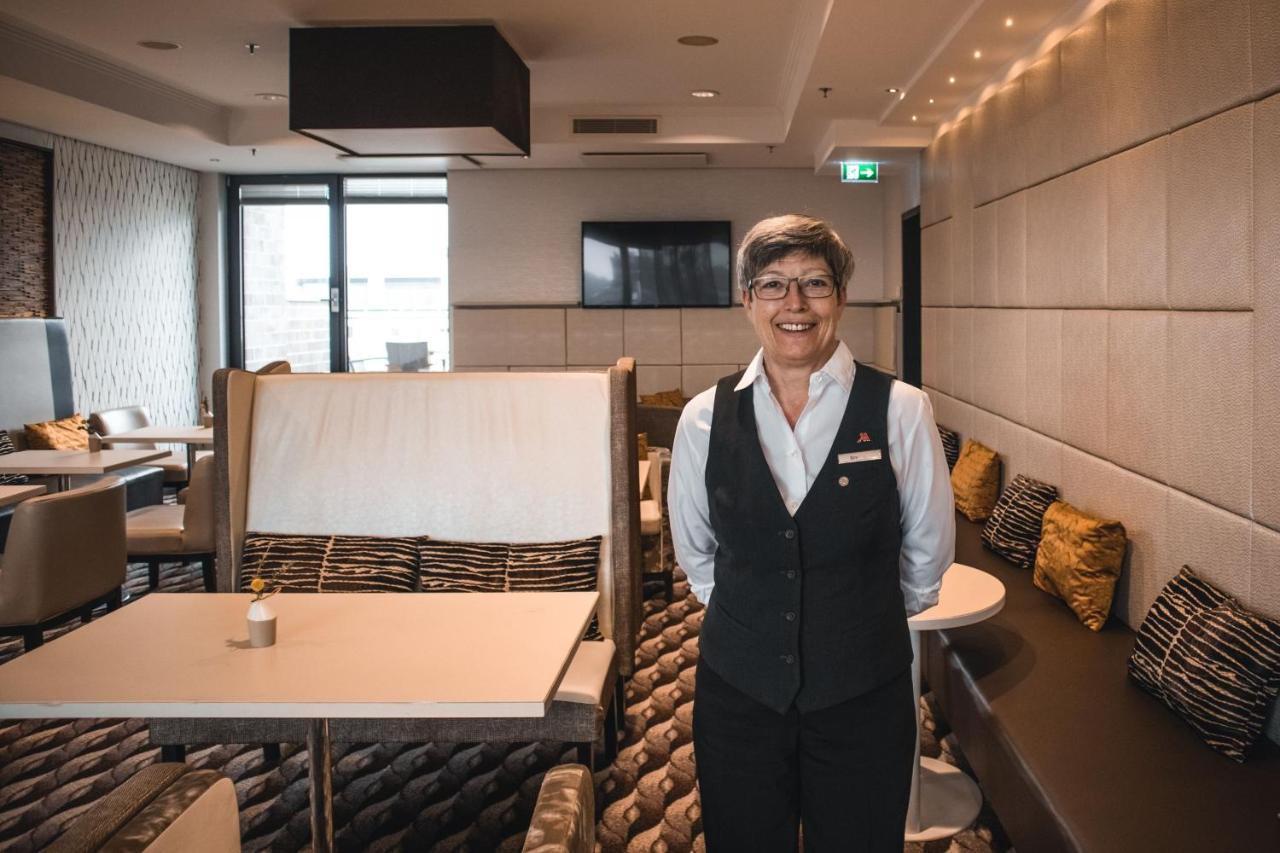 Cologne Marriott Hotel Екстериор снимка A flight attendant in the new uniform